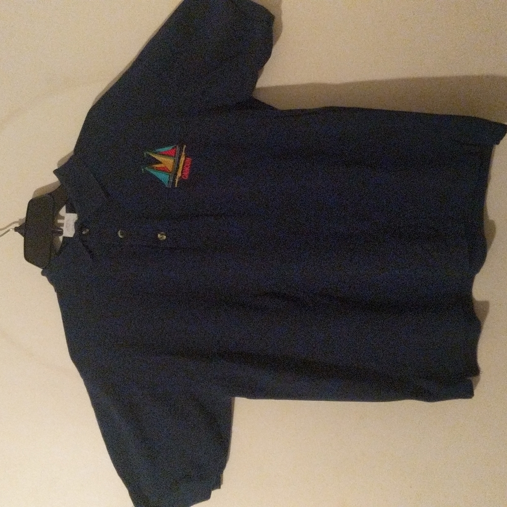 Polo shirt with a Cancun and Ship embroidered insignia